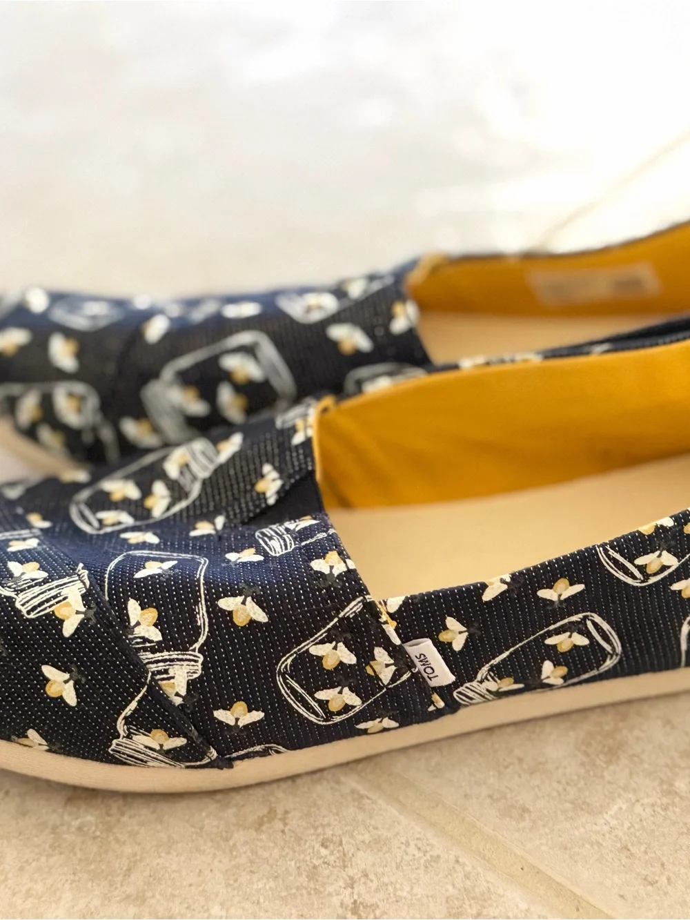 Toms Glow in the dark firefly’s Jar-Print Slip-Ons